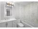 Updated bathroom with white vanity, a soaking tub and new fixtures at 10140 Bridlewood Ave, Orlando, FL 32825