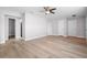 Large bedroom with light gray walls and wood-look floors at 10140 Bridlewood Ave, Orlando, FL 32825