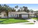 House exterior view, white with brown stone, single story at 10140 Bridlewood Ave, Orlando, FL 32825