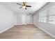 Spacious living room with light gray walls and wood-look floors at 10140 Bridlewood Ave, Orlando, FL 32825