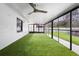 Relaxing screened porch with artificial turf at 10140 Bridlewood Ave, Orlando, FL 32825