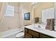 Clean bathroom with tub, toilet, and vanity at 107 Alexandra Woods Dr, Debary, FL 32713