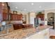 Kitchen with granite countertops and dark wood cabinets at 107 Alexandra Woods Dr, Debary, FL 32713