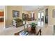 Living room with a view into the dining area and kitchen at 107 Alexandra Woods Dr, Debary, FL 32713