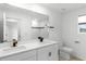 Elegant bathroom with double vanity and modern fixtures at 11833 Founders St, Orlando, FL 32832