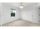 Well-lit bedroom with ceiling fan and window view at 11833 Founders St, Orlando, FL 32832