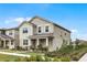 Two-story house with gray siding, shutters, and a landscaped lawn at 11833 Founders St, Orlando, FL 32832