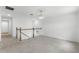 Open loft with neutral carpeting and staircase at 11833 Founders St, Orlando, FL 32832