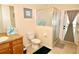 Bathroom with shower, toilet, and double vanity at 142 Sandy Point Way, Clermont, FL 34714