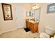 Clean bathroom with single vanity, toilet, and shower at 142 Sandy Point Way, Clermont, FL 34714