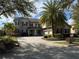 Beautiful two-story home with stone accents, shuttered windows and lush landscaping at 15041 Gaulberry Run, Winter Garden, FL 34787