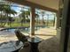 Screened lanai overlooking the pool and backyard, offering a serene outdoor living space at 15041 Gaulberry Run, Winter Garden, FL 34787