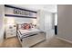 Nautical-themed bedroom with white bed frame and built-in closet at 1521 Isleta Loop, Kissimmee, FL 34741