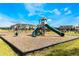 Community playground with swings, slides, and play structures at 1521 Isleta Loop, Kissimmee, FL 34741