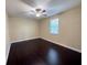 Bedroom with ceiling fan and dark hardwood floors at 15306 Southern Martin St, Winter Garden, FL 34787