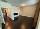 Spacious bedroom with hardwood floors and an electric fireplace at 15306 Southern Martin St, Winter Garden, FL 34787