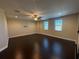 Bright bonus room featuring hardwood floors and large windows at 15306 Southern Martin St, Winter Garden, FL 34787