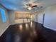 Spacious bonus room with hardwood floors and a view of the upper hallway at 15306 Southern Martin St, Winter Garden, FL 34787