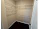 Spacious walk-in closet with wire shelving and hanging rods at 15306 Southern Martin St, Winter Garden, FL 34787