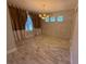 Elegant dining room with wood-look tile floors and stone wall at 15306 Southern Martin St, Winter Garden, FL 34787