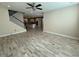 Spacious living room with hardwood floors and a view of the kitchen at 15306 Southern Martin St, Winter Garden, FL 34787