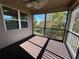 Relaxing screened porch with composite decking and wooded views at 15306 Southern Martin St, Winter Garden, FL 34787