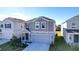 Two-story house with gray siding and a two-car garage at 1534 Marksman Rd, Eagle Lake, FL 33839