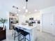 Modern kitchen with white cabinets and island at 1534 Marksman Rd, Eagle Lake, FL 33839