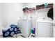 Well-equipped laundry room with washer and dryer at 1534 Marksman Rd, Eagle Lake, FL 33839