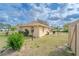 Expansive backyard featuring a well-maintained lawn and storage shed at 160 Clay Cut Cir, Haines City, FL 33844