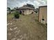 House backyard view with shed and chain link fence at 160 Clay Cut Cir, Haines City, FL 33844