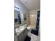 Bathroom features a tub, toilet, and vanity at 160 Clay Cut Cir, Haines City, FL 33844