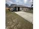 Single-story home with a landscaped yard and driveway at 160 Clay Cut Cir, Haines City, FL 33844