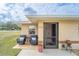 Welcoming front entrance features a cozy seating area, perfect for relaxing outdoors at 160 Clay Cut Cir, Haines City, FL 33844