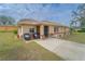 Inviting front porch with comfortable seating and a view of the well-manicured front yard at 160 Clay Cut Cir, Haines City, FL 33844