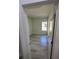 Small bedroom with window and grey wood-look floors at 1617 Cumin Dr, Kissimmee, FL 34759