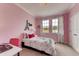 Charming bedroom with a Parisian themed decor at 1664 Three Bars Rd, Kissimmee, FL 34744