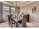 Formal dining room with dark wood table and neutral decor at 1664 Three Bars Rd, Kissimmee, FL 34744