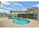 Refreshing kidney-shaped pool with screened enclosure at 1685 Waterview Loop, Haines City, FL 33844