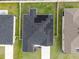 Aerial view of a house with solar panels at 1933 Burgundy Dr, Minneola, FL 34715