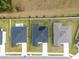 Aerial view of three houses with solar panels at 1933 Burgundy Dr, Minneola, FL 34715