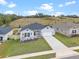 Aerial view of a house and street at 1933 Burgundy Dr, Minneola, FL 34715