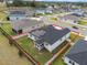 Aerial view of a house featuring solar panels and a backyard at 1933 Burgundy Dr, Minneola, FL 34715