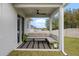 Outdoor patio area with seating and ceiling fan at 1933 Burgundy Dr, Minneola, FL 34715