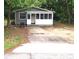 Gray house with screened porch, and a yard at 2204 Suanee Ave, Eustis, FL 32726