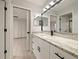 Modern bathroom with granite countertop and white cabinets at 240 Shady Oaks Cir, Lake Mary, FL 32746