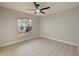 Light-filled bedroom with window and ceiling fan at 240 Shady Oaks Cir, Lake Mary, FL 32746