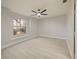 Bright bedroom with wood-look floors and large window at 240 Shady Oaks Cir, Lake Mary, FL 32746