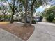 Side view of house showcasing driveway and landscaping at 240 Shady Oaks Cir, Lake Mary, FL 32746