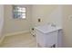 Laundry room with utility sink and vinyl flooring at 240 Shady Oaks Cir, Lake Mary, FL 32746